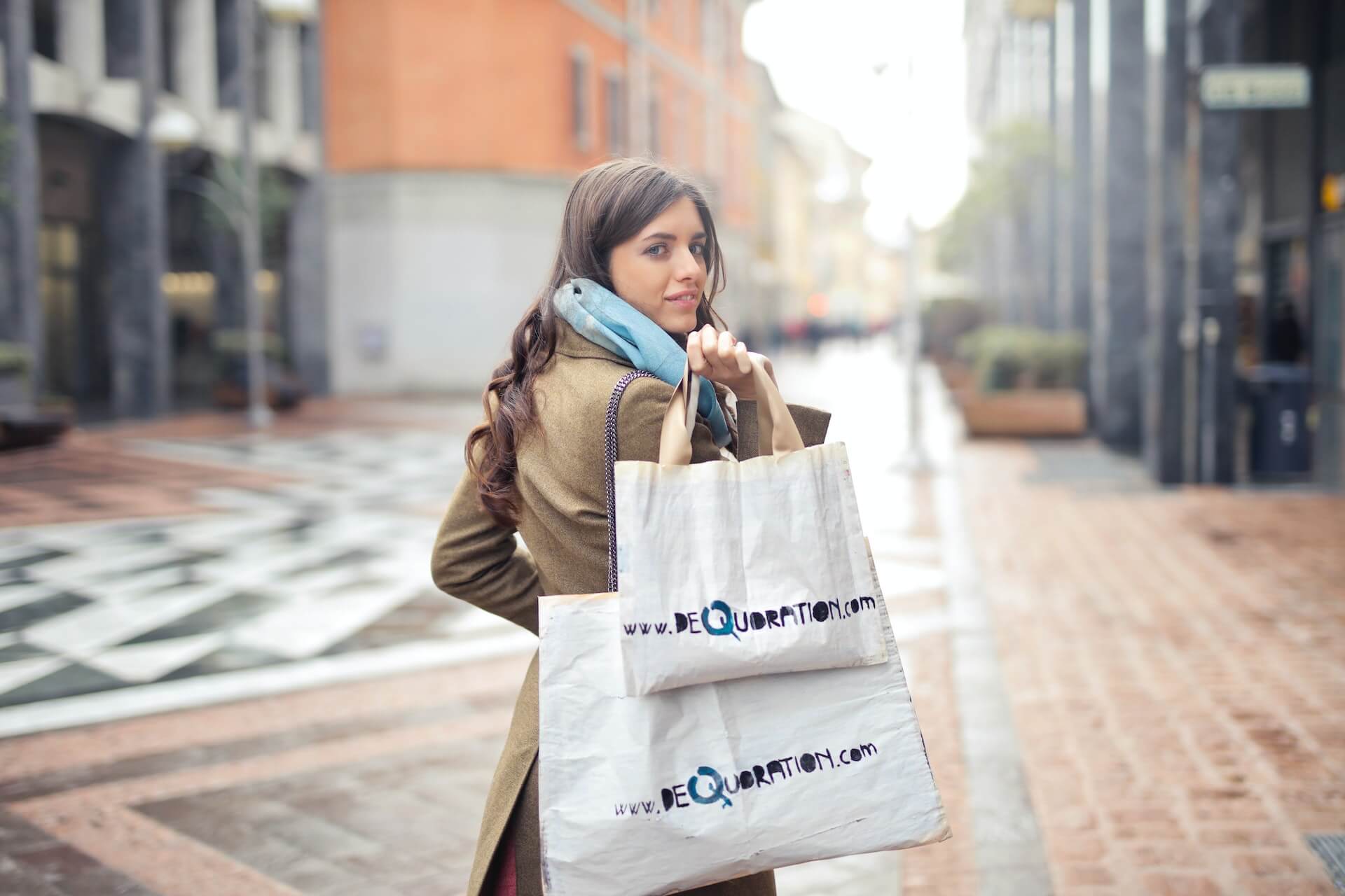 Photo by Andrea Piacquadio: https://www.pexels.com/photo/woman-in-brown-coat-carrying-two-white-tote-bags-919453/