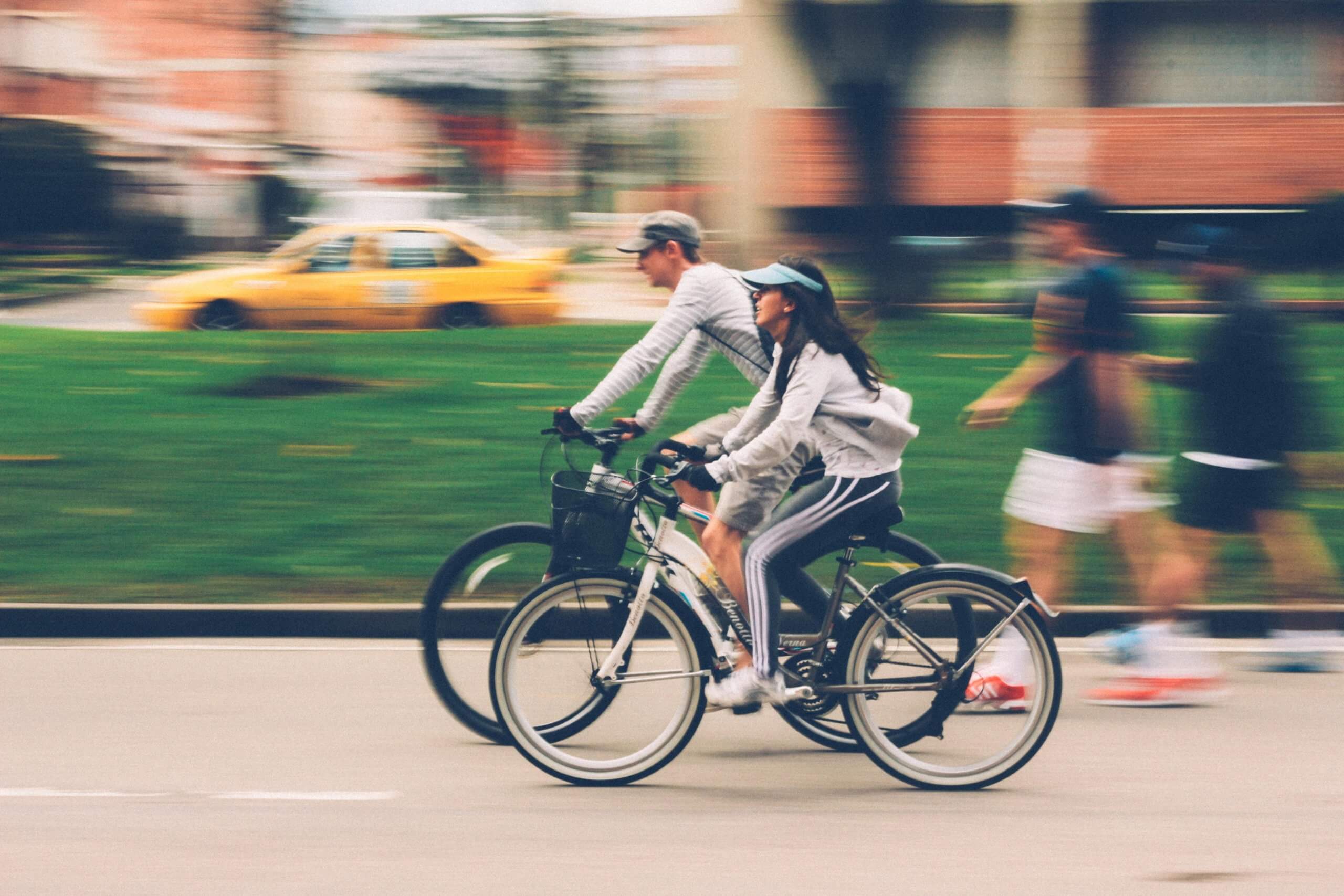 Woman and man riding on bike